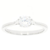 White Moissanite sterling silver ring with accent stones, featuring a brilliant round-cut gemstone in a sophisticated design.